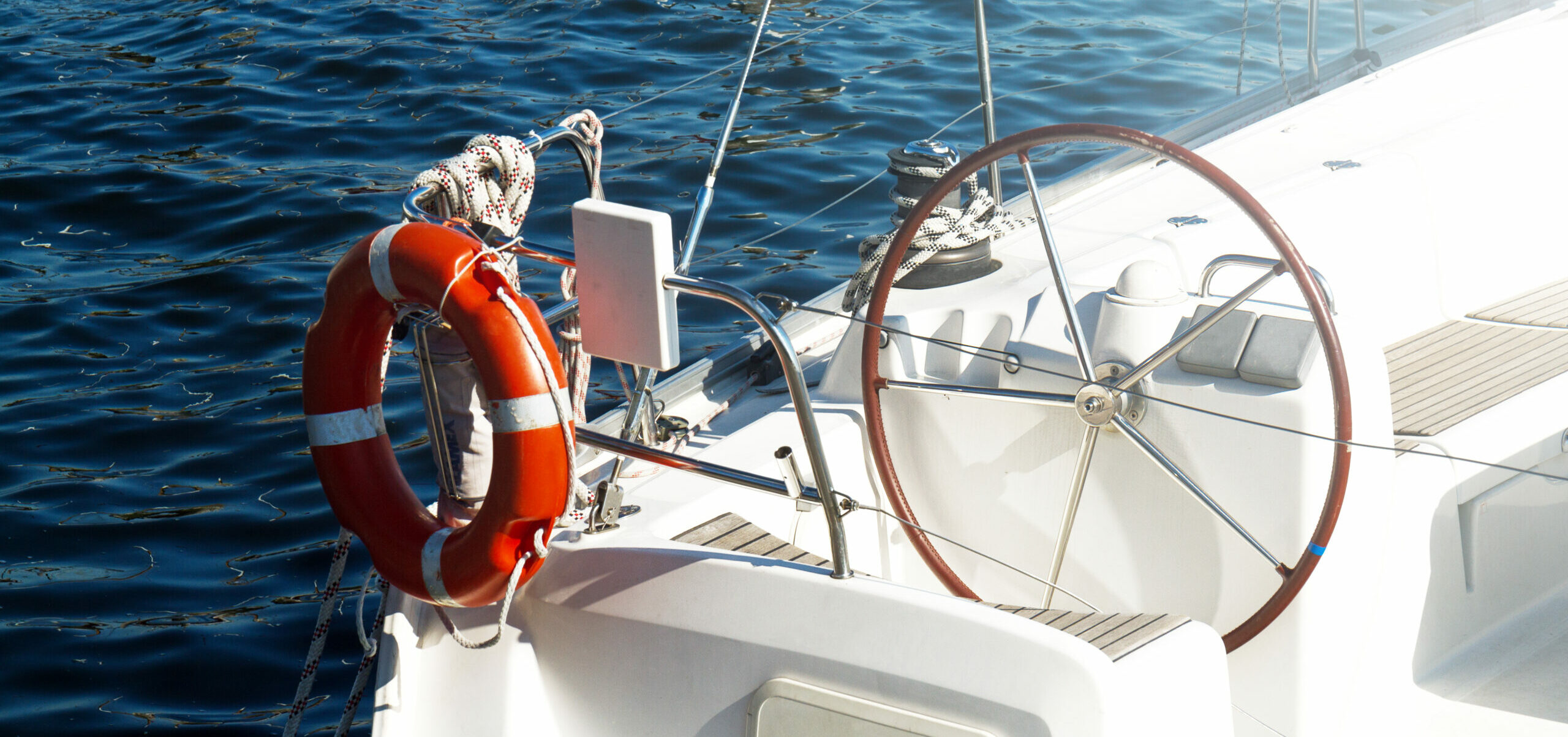 Closeup of Beautiful Yacht Rudder. Daylight. Horizontal. Sea Bac